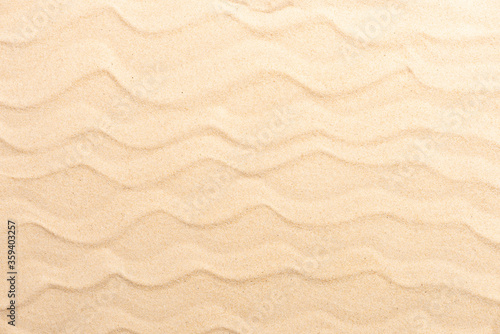 Sandy beach for background. Sand texture close up. Flat lay and top view and above, copy space