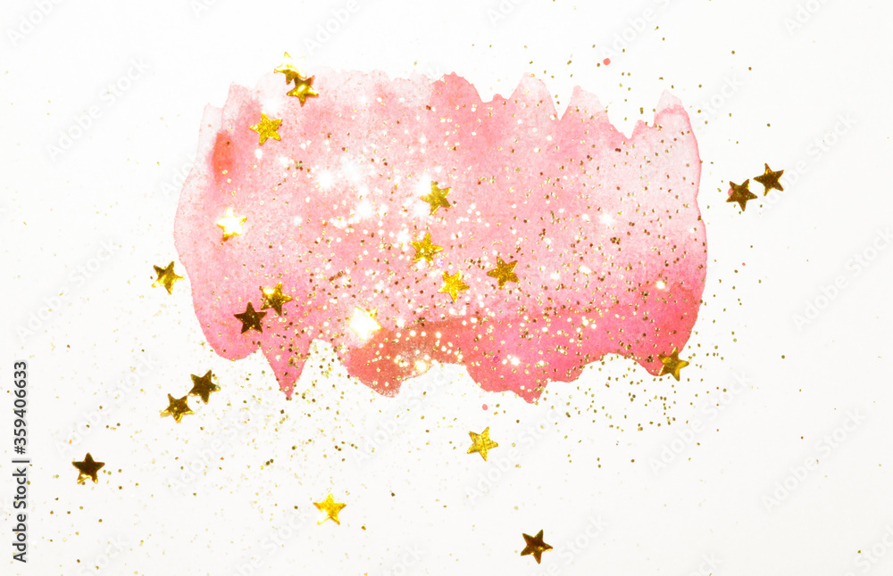 Golden glitter and glittering stars on abstract pink watercolor splash in vintage nostalgic colors on light gray background