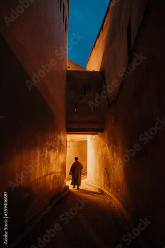 Night view of the old streets in the Fes Medina quarter in Northern Morocco. A medina is typically walled, with many narrow and maze-like streets.