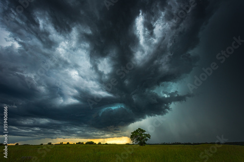 Supercell storm clouds with intense tropic rain photo