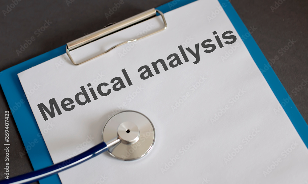Medical analysis text . Concept means a report or noteworthy medical breakthrough information. gray background and stethoscope Medical analysis text . Concept means a report or noteworthy medical breakthrough information. gray background and stethoscope
