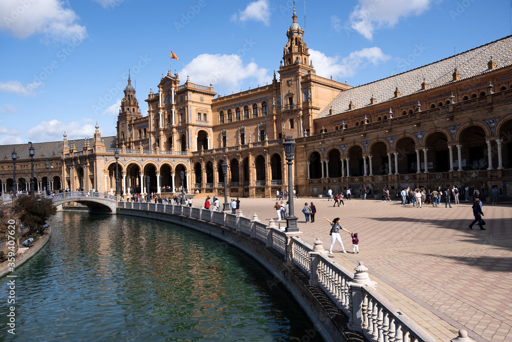 Seville, Spain - October 20, 2019: Tourists Sightseeing Around Plaza De Espana In Seville, Spain At Sunny Day. Amazing Architecture.