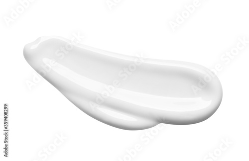 White lotion swatch isolated on white. Cosmetic liquid cream texture. Skin care product macro. photo