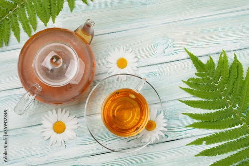 Herbal tea in teapot and cup