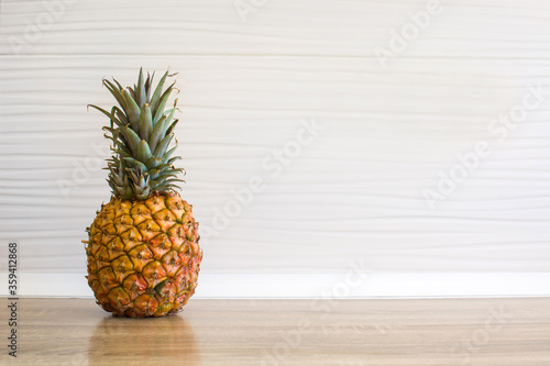 Fresh pineapple in the kitchen. Copy space