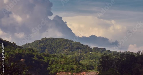 Hyperlaps cloudy sky near phuket hill. 4K DCI resolution 4096x2160 colored in Davinci Resolve 24 fps taken by GH5s photo