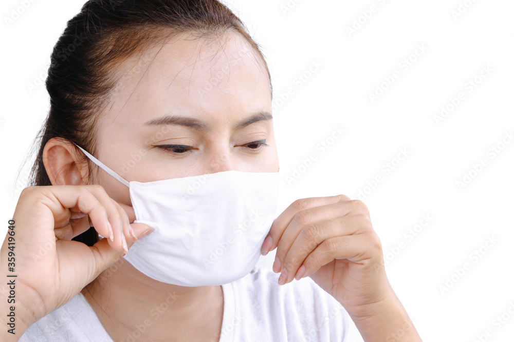 Closeup asian woman wearing face mask for protect air polution or virus covid 19, health care and medical concept Closeup asian woman wearing face mask for protect air polution or virus covid 19, health care and medical concept