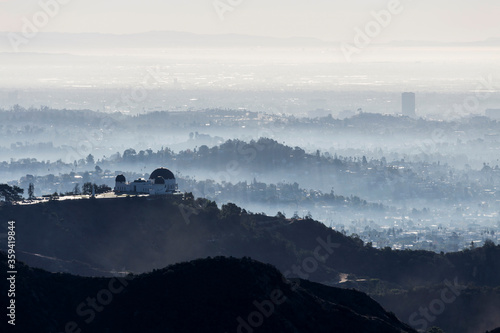 Fototapeta Foggy morning view of Griffith Park and nearby canyons in Los Angeles, California