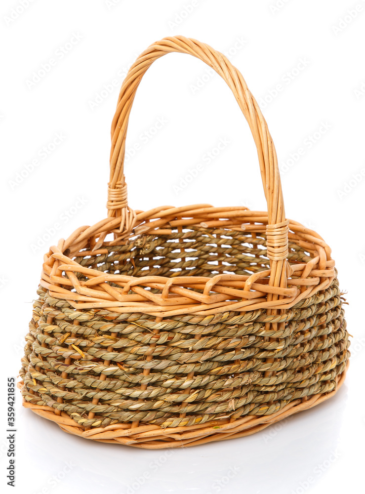 Beautiful handmade wicker basket isolated on white.