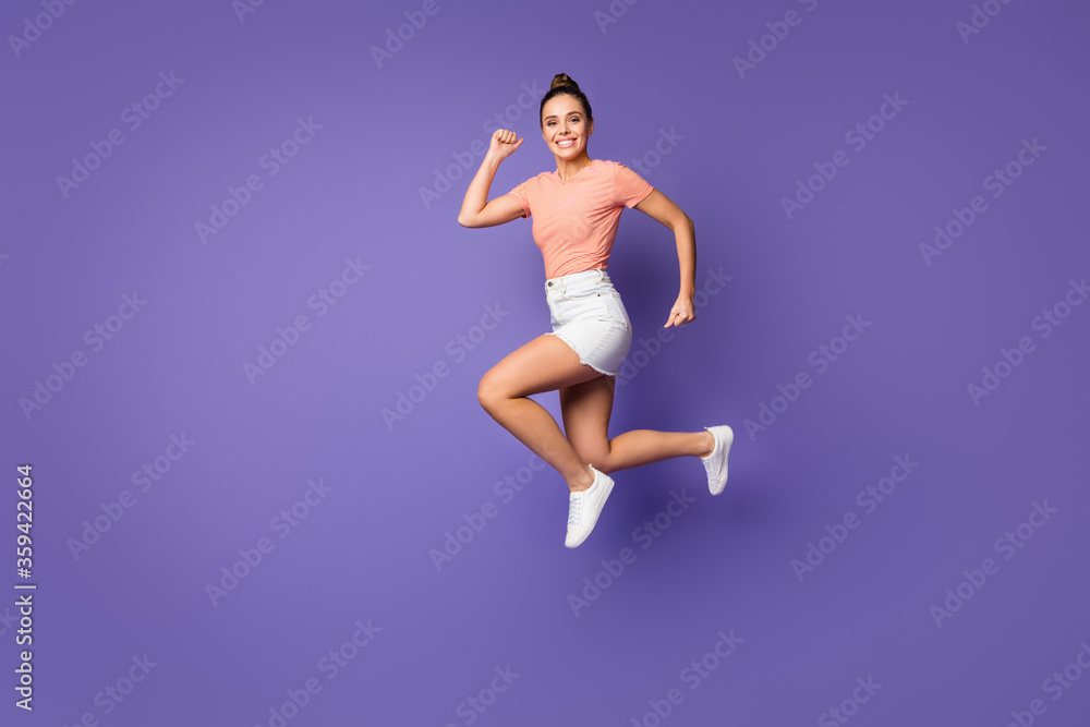 Full length profile side photo of cheerful funky girl jump run copyspace after spring discount wear white good look clothes shoes isolated over violet color background