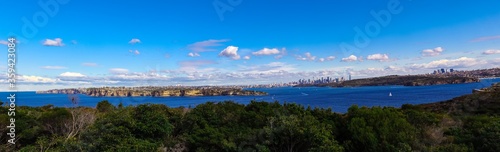 Fototapeta Naklejka Na Ścianę i Meble -  Panoramic view of Sydney Harbour in NSW Australia on a cold winters day Partly cloudy skies 