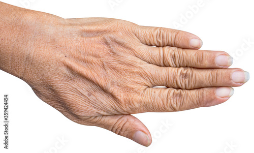 The back of the hand on an old Asian woman solated white background, close up.