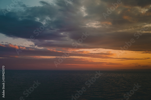Multicolored red sky at sunset on the sea
