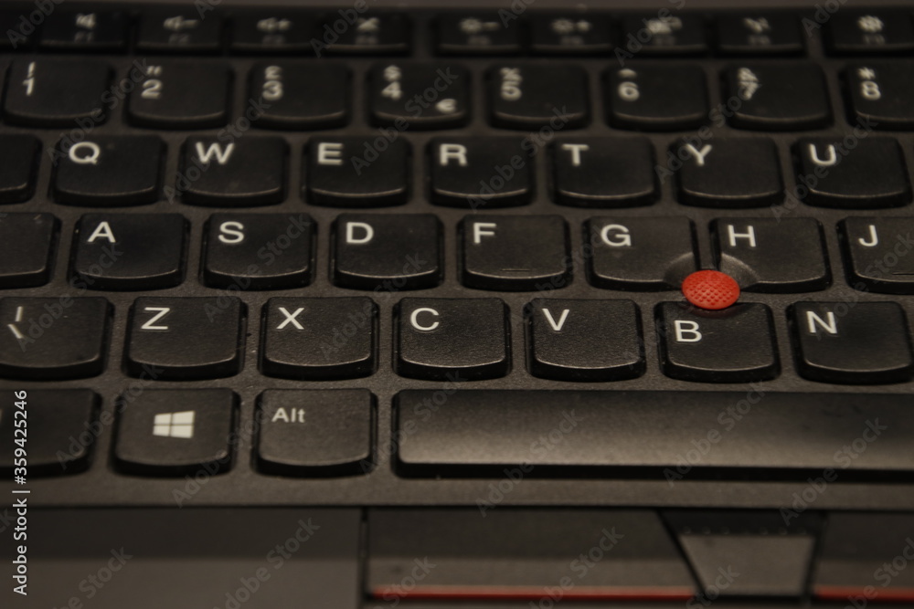 Computer keyboard with red button Computer keyboard with red button