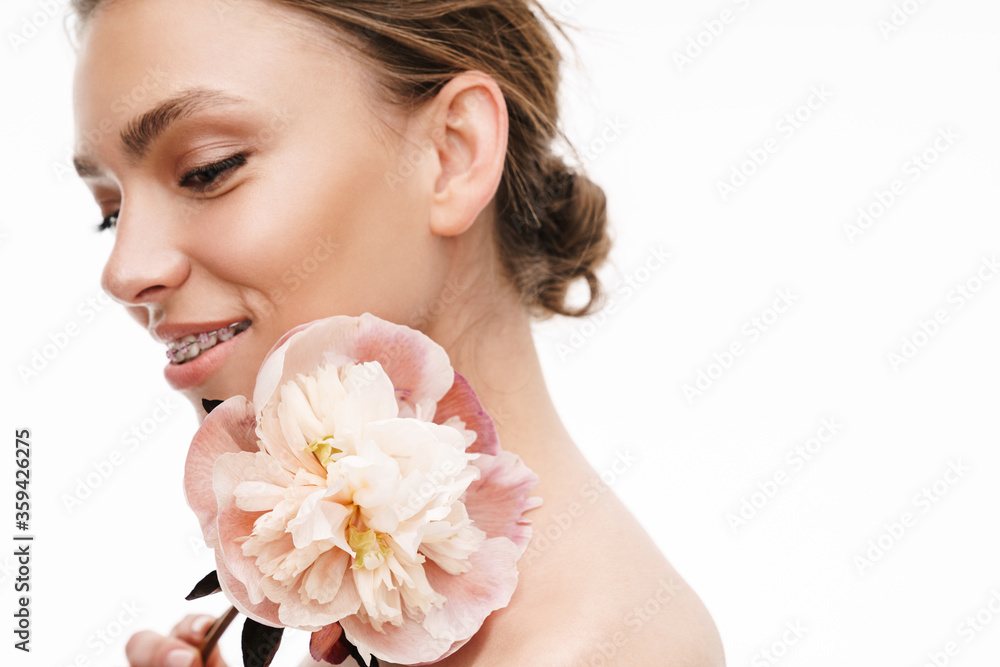 Image of beautiful young happy shirtless woman holding peony flower