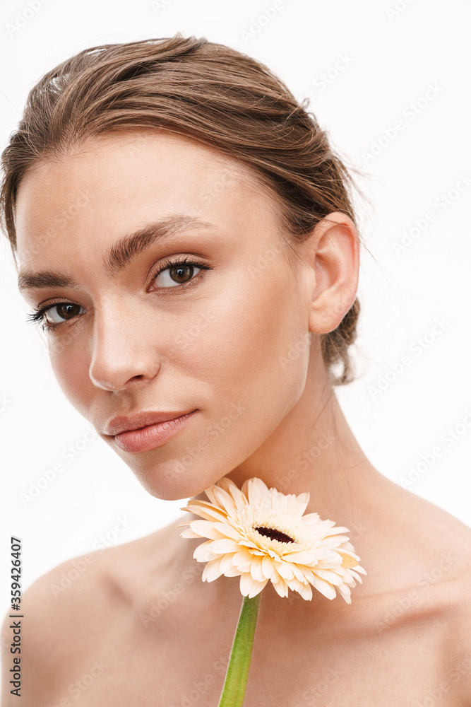 Image of beautiful caucasian young happy shirtless woman holding flower