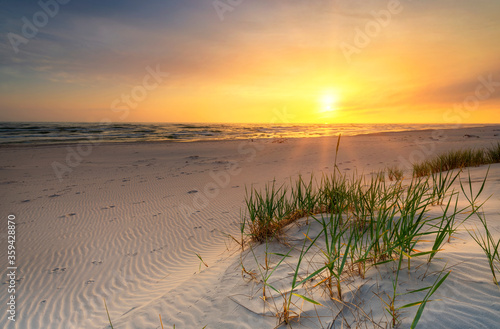 Fototapeta Naklejka Na Ścianę i Meble -  Beautiful summer sunset over beach at Baltic sea