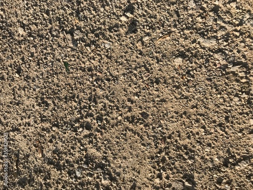 background texture of a dirt road from the ground clay and stones