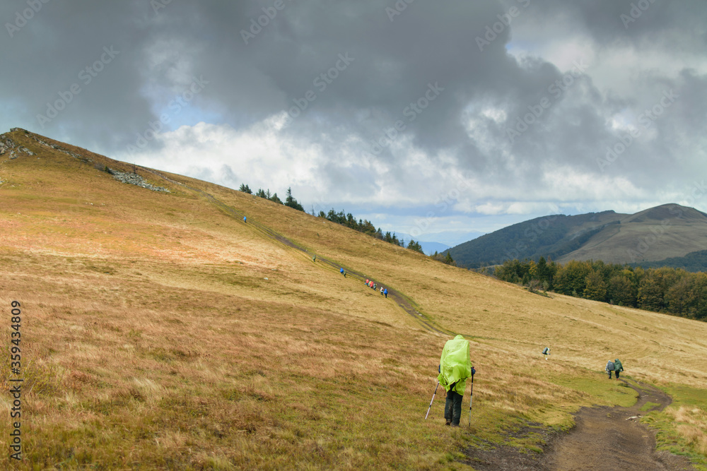 A group of people go hiking in the mountains.