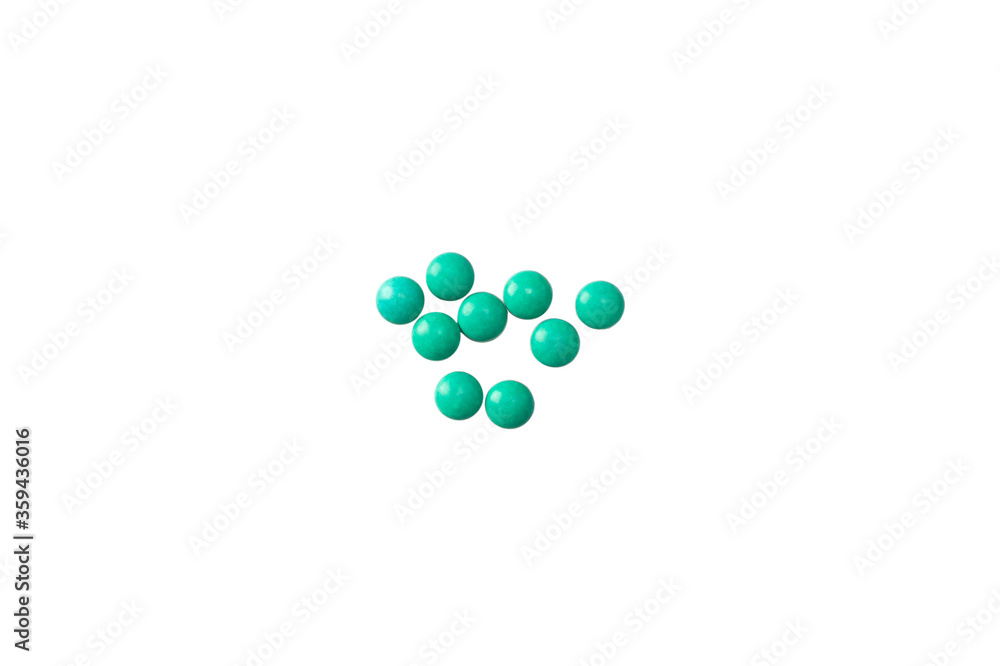 Pile of green tablets drugs on white background isolated Pile of green tablets drugs on white background isolated