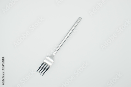 stainless fork ina white background