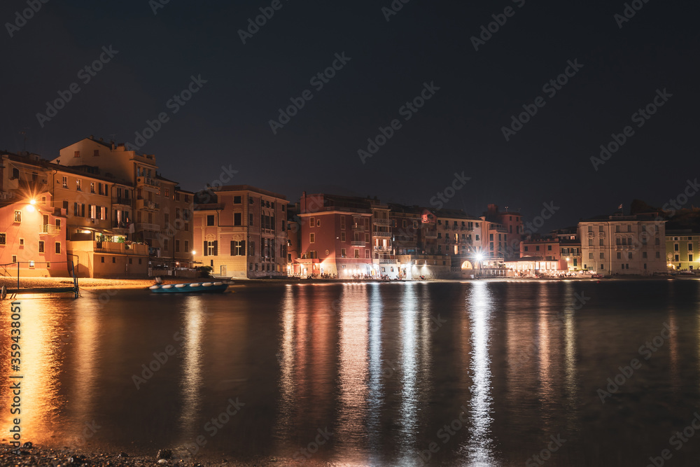 Panoramic night view of beatiful sea resort town. Romantic vacation. Italy, Sestri Levante, Bay of Silence