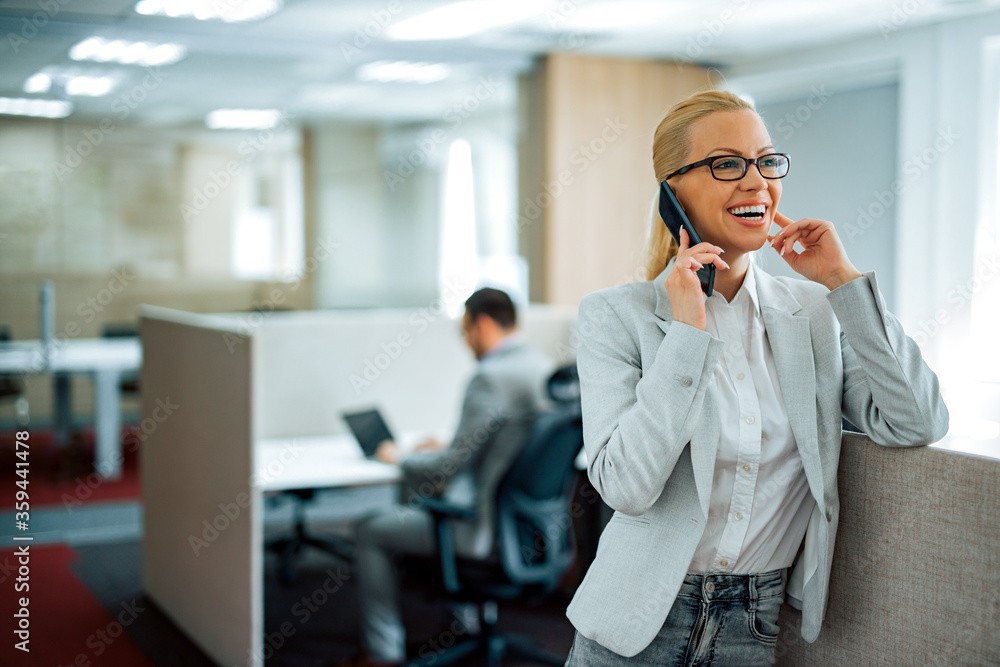 Portrait of successful business manager talking on smart phone.