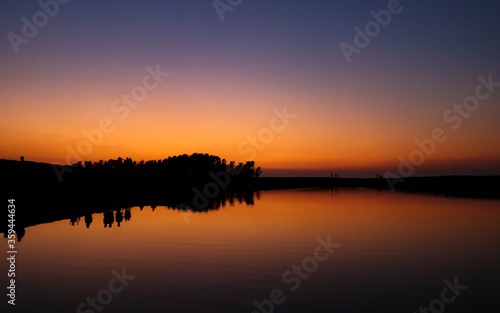 Beautiful landscape of sunset reflected on a lake on summer