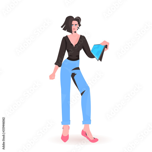 woman holding tablet pc beautiful girl model in trendy clothes female cartoon character standing pose full length isolated vector illustration