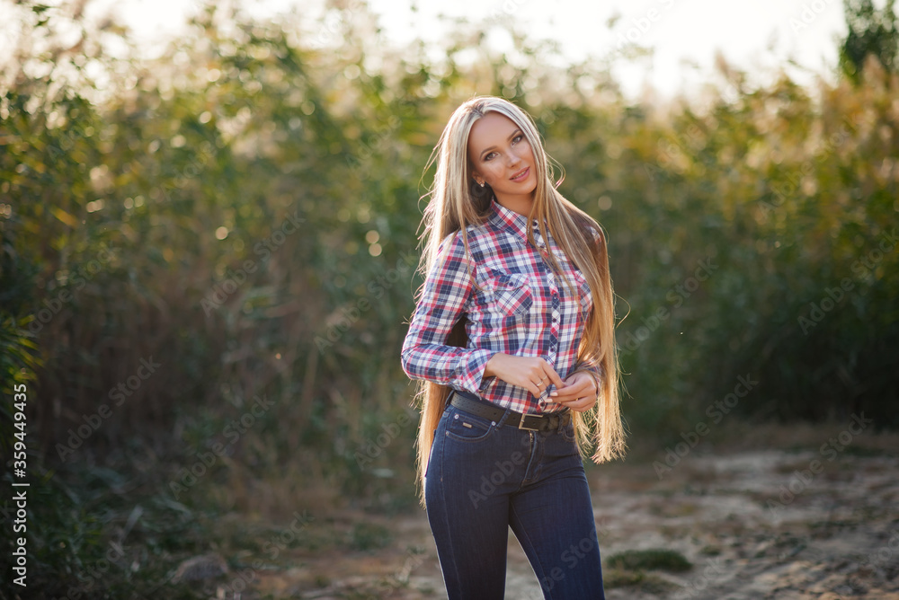 Beautiful girl is smiling. Sunny warm colors. Copyspace Beautiful girl is smiling. Sunny warm colors. Copyspace