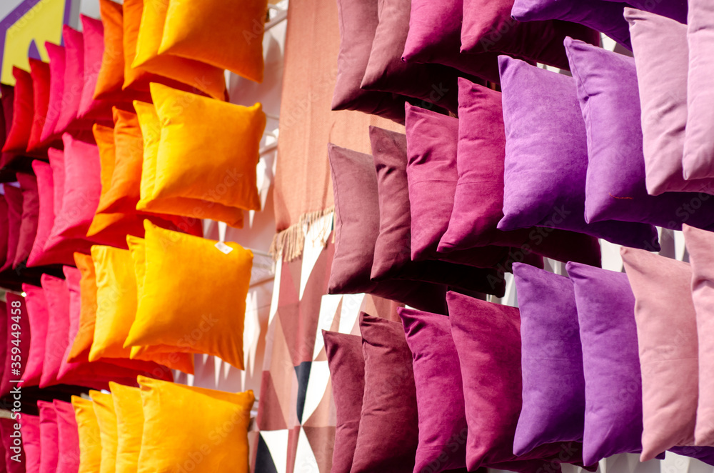 Colorful fabric cushions for sale in the store
