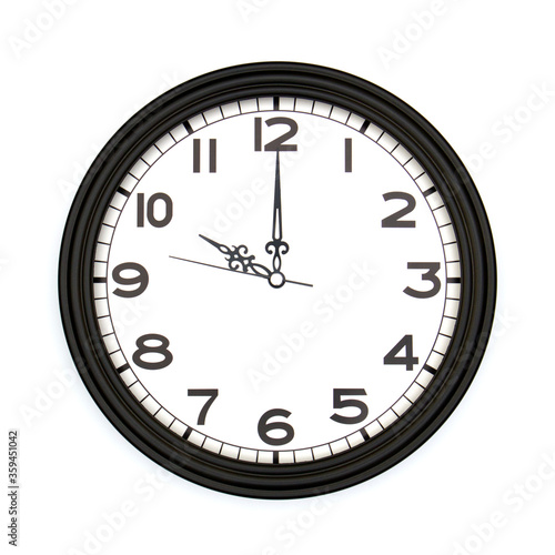 Black round analog wall clock isolated on white background, its ten oclock.