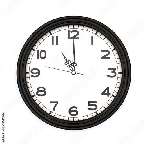 Black round analog wall clock isolated on white background, its eleven oclock.
