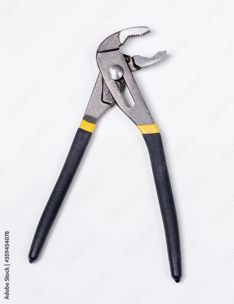 Obraz premium Adjustable water pump pliers with black handles isolated on white background.Universal wrench. Professional tool for work. Flat lay, top view