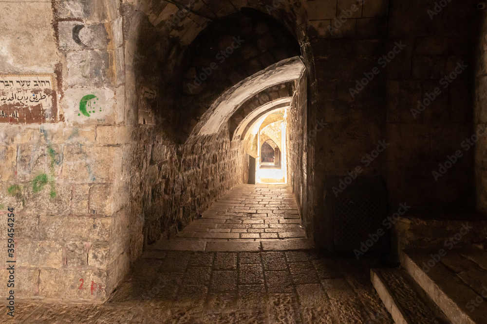 Jerusalem, Israel, The tunnel passing under the houses - the Shaar Barzel - Iron Gate - Bab al-Hadid Street in the Arab Quarter in the old city of Jerusalem, Israel