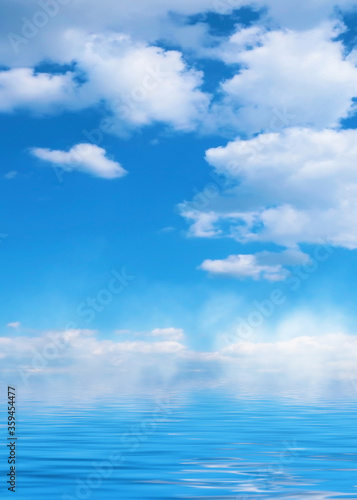 Summer landscape. Blue sea and blurry sky with fluffy clouds. Br