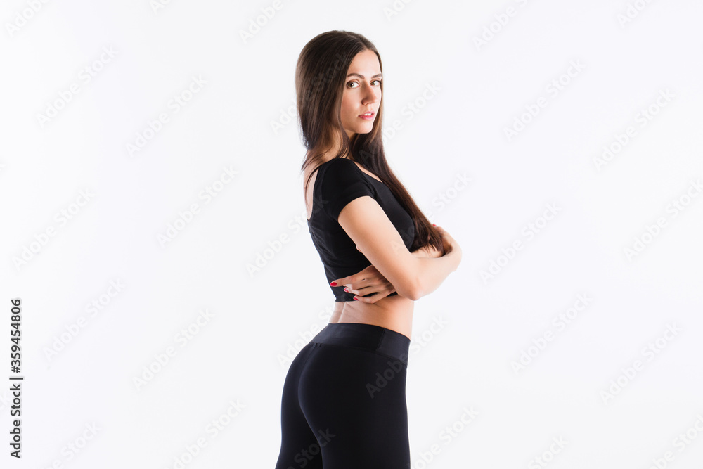Beautiful athletic woman in black sportswear isolated on white. Beautiful athletic woman in black sportswear isolated on white.