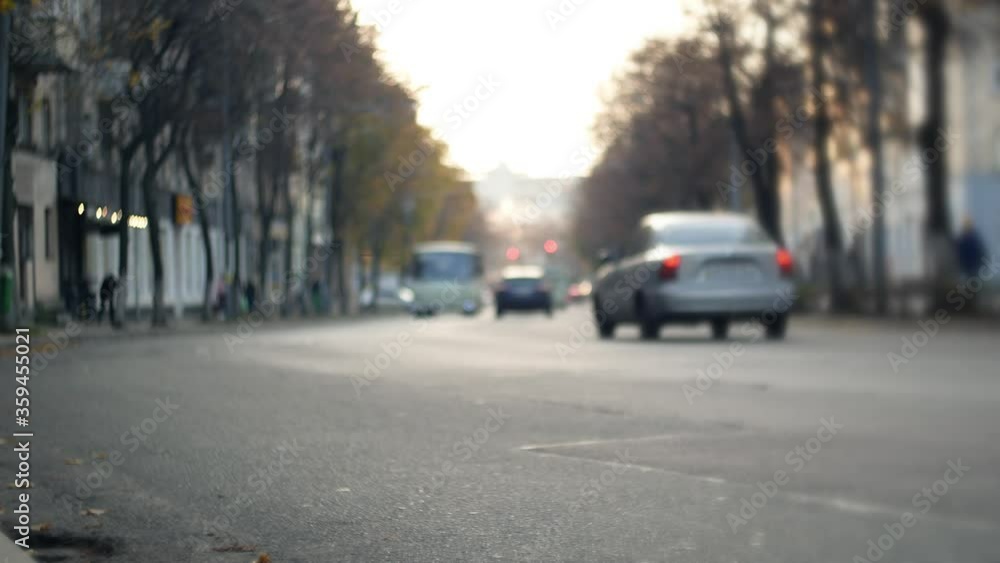 City traffic. Cars are moving on the road in bokeh City traffic. Cars are moving on the road in bokeh