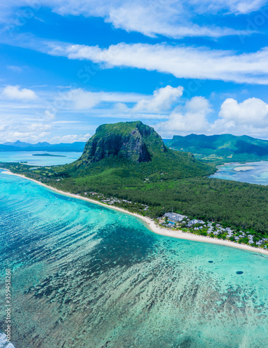 Aerial panoramic view of Mauritius island - Detail of Le Morne Brabant mountain with underwater waterfall perspective optic illusion - Wanderlust and travel concept with nature wonders on vivid filter photo