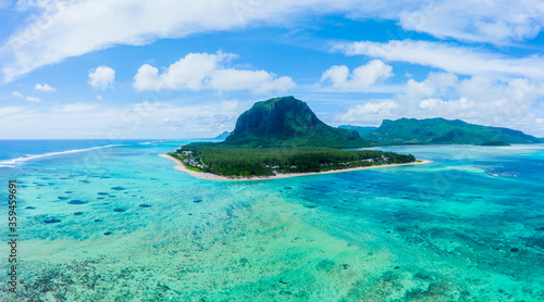 Aerial panoramic view of Mauritius island - Detail of Le Morne Brabant mountain with underwater waterfall perspective optic illusion - Wanderlust and travel concept with nature wonders on vivid filter photo