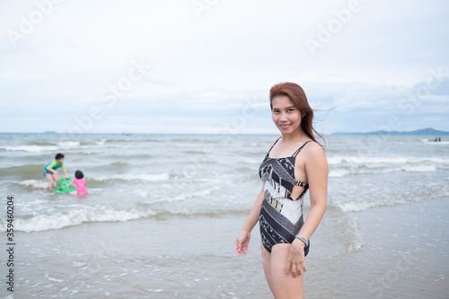 portrait woman standing at beach, travel on holidays, Girl enjoying at summer, Young woman relax on beach, Happy time 