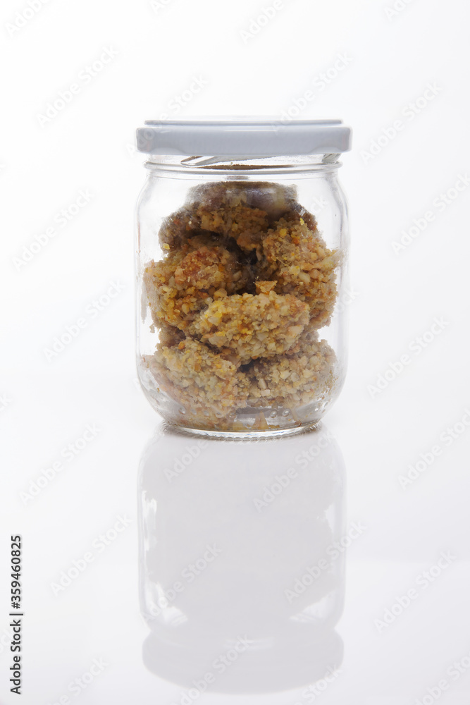Nutrition concept - Healthy food, Diet, Detox, Clean Eating or Vegetarian concept. A nutritious food on glass jars against white background. Nutrition concept - Healthy food, Diet, Detox, Clean Eating or Vegetarian concept. A nutritious food on glass jars against white background.