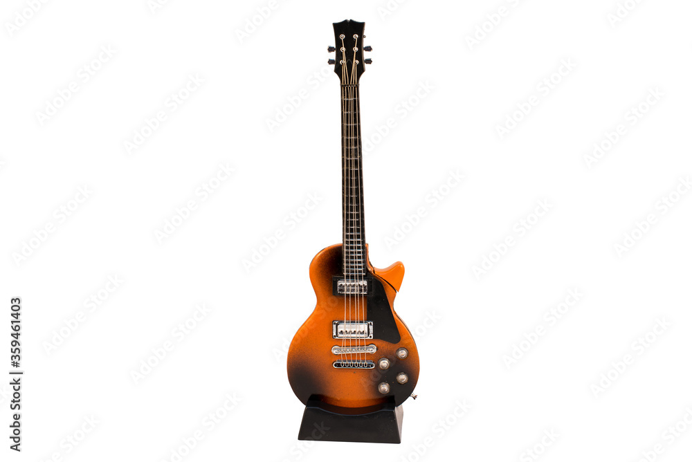 Electric guitar figurine on a stand on a white background, isolated