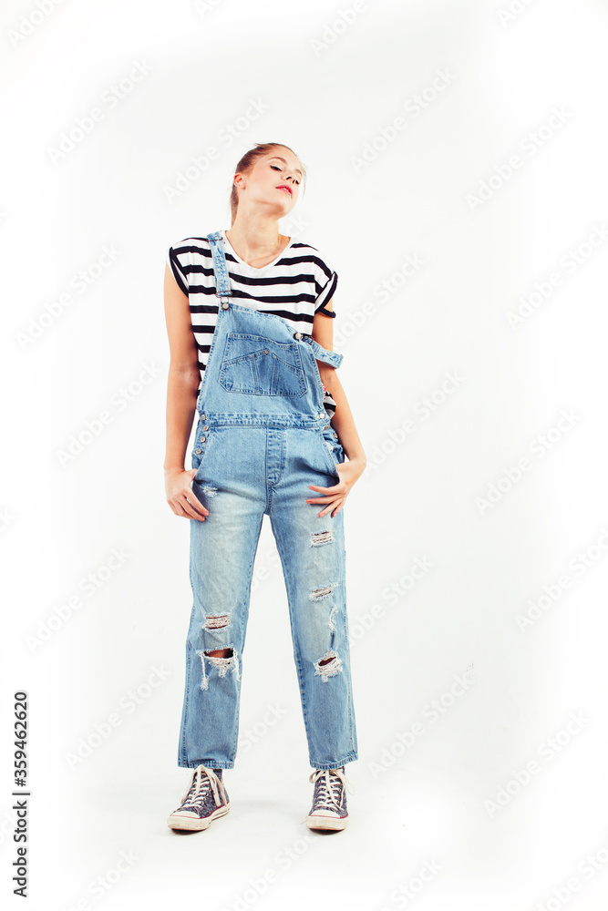 Fototapeta premium young pretty teenage hipster girl posing emotional happy smiling on white background, lifestyle people concept