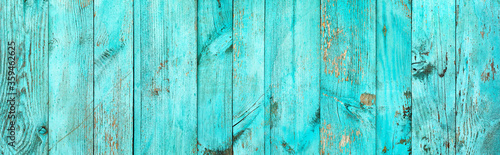 Weathered blue wooden background texture. Shabby wood teal or turquoise green painted. Vintage beach wood backdrop.