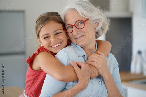 Portrait of smiling grandmother with grandkid photo