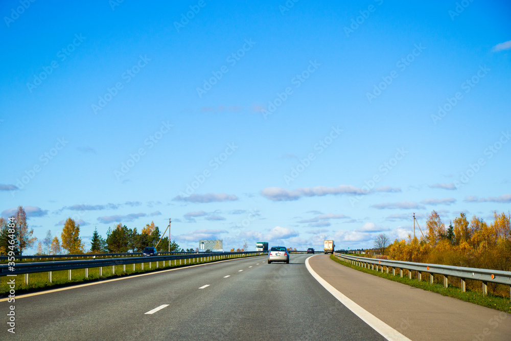 Highway, autobahn and road landscape. Automobile, cars and vehicles. Blue sky and sunny day. European autobahn.