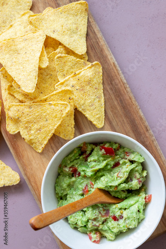 Mexican dip sauce guacamole with nachos chips. Mexican food. Healthy eating. Vegetarian food.