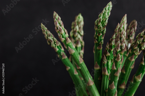 Asparagus. Fresh green asparagus on black  background.