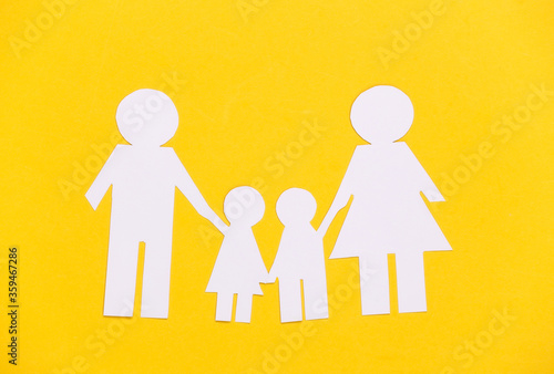 Paper happy family together on yellow background.